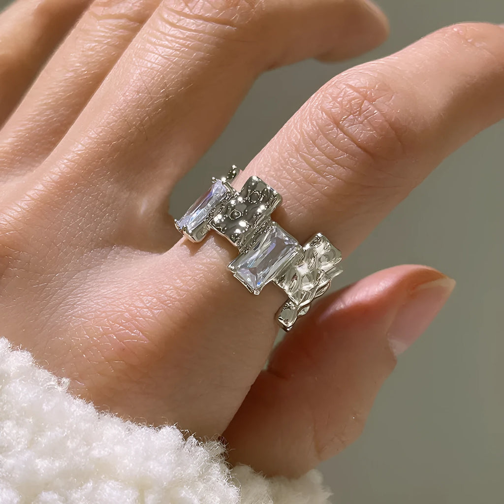 Silver geometric ring with cross zircon design and open gemstone setting