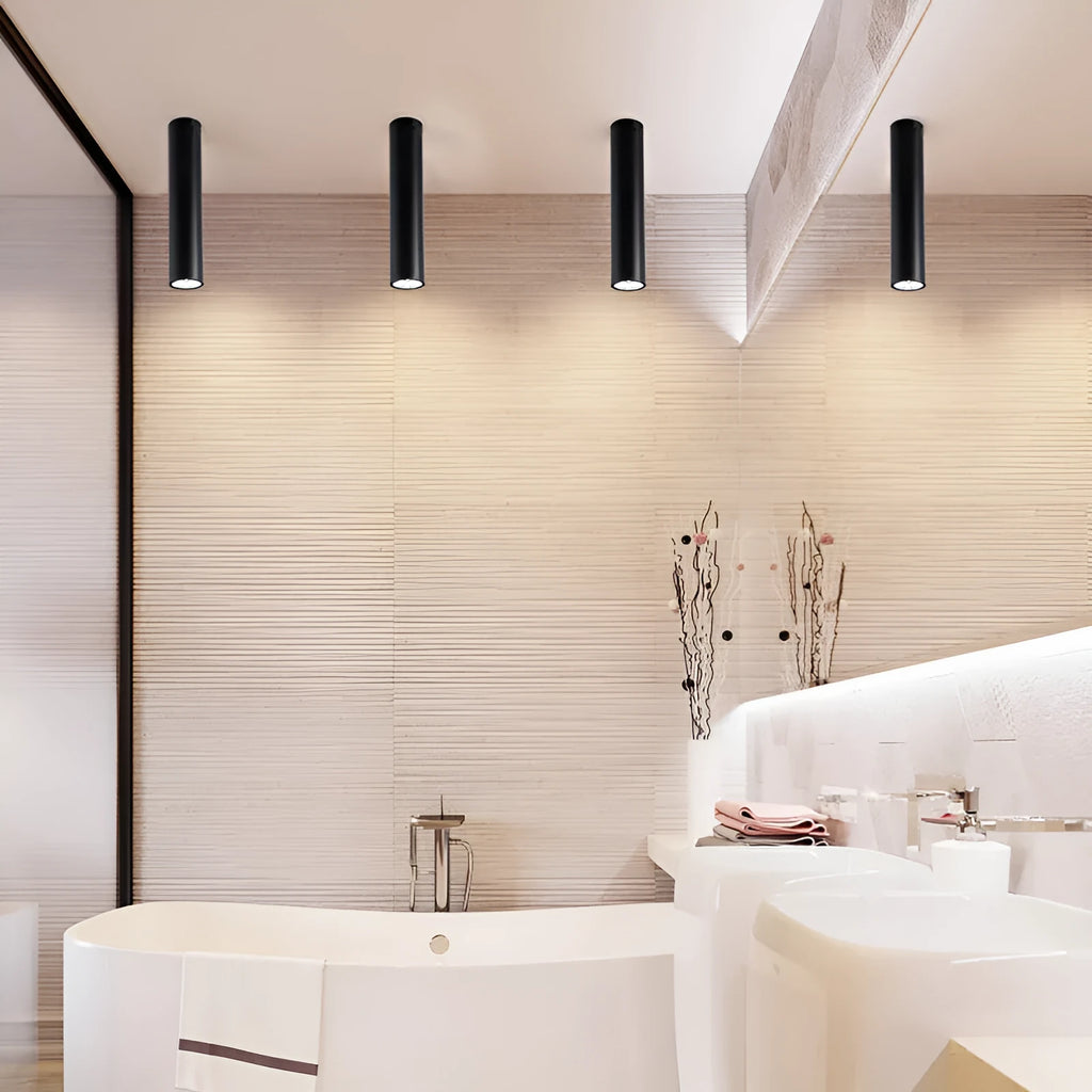 Black round surface mounted LED ceiling downlight spotlight in warm white or cool white light.
