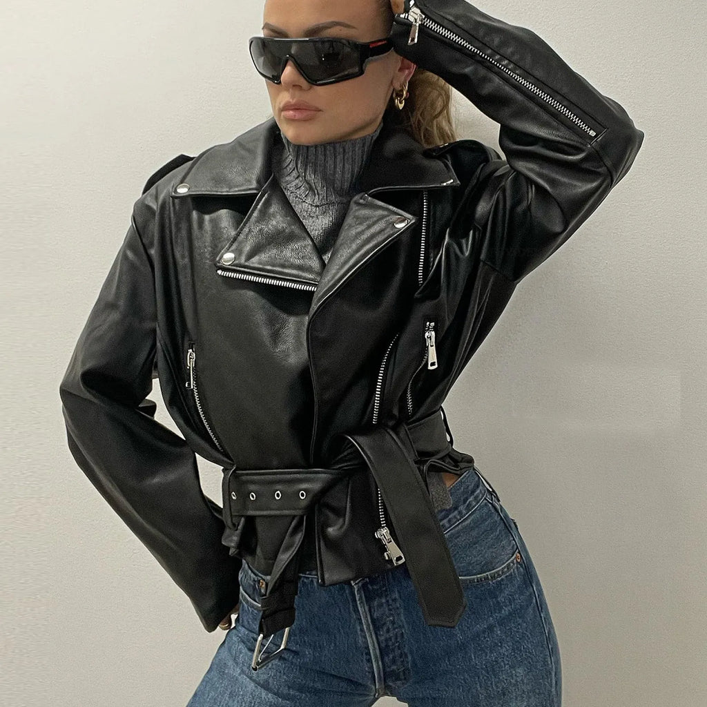 Black punk locomotive jacket with a round Peter Pan collar and a drawstring waist on a hanger.