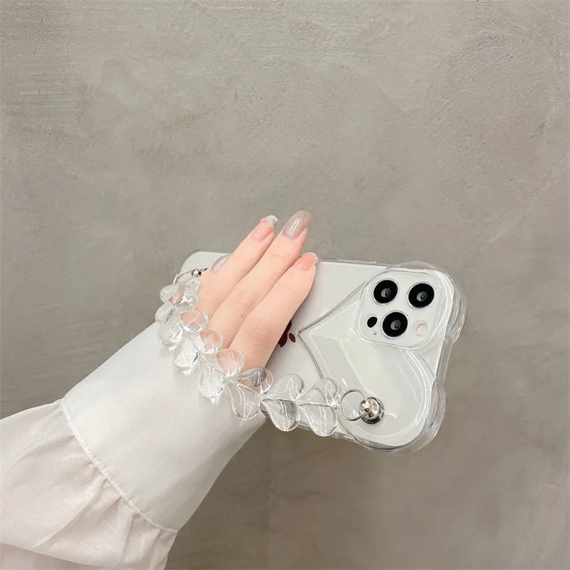 Transparent iPhone case with a love heart and bracelet chain design on a soft TPU background.