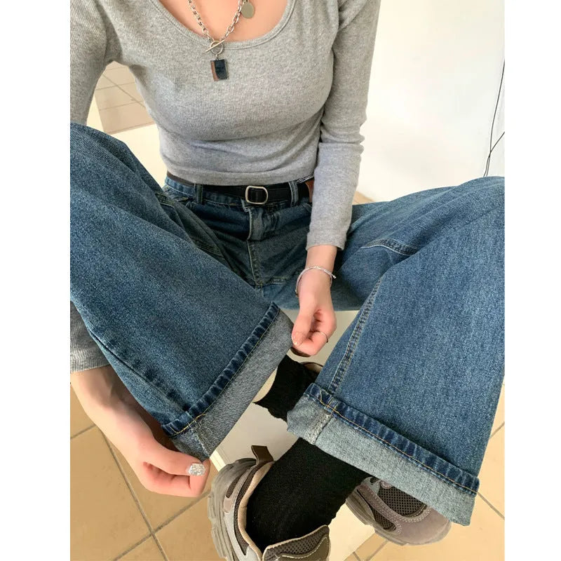 Women's high-waisted retro blue straight-leg jeans in 100% cotton denim laid flat.