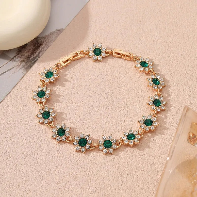 Coloured gemstone bracelet with flower-shaped design in gold and silver colour variations