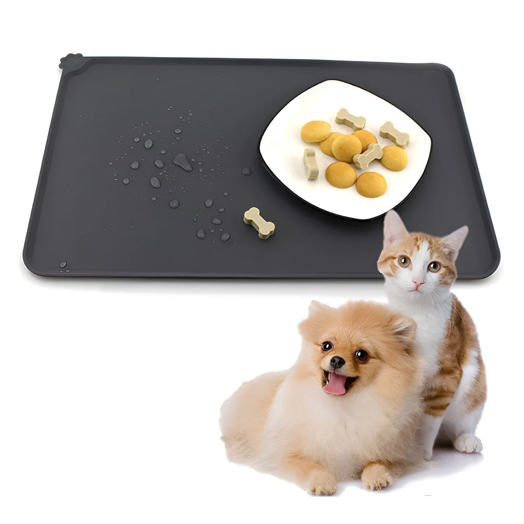 Grey silicone pet food mat with raised edges on a tile floor