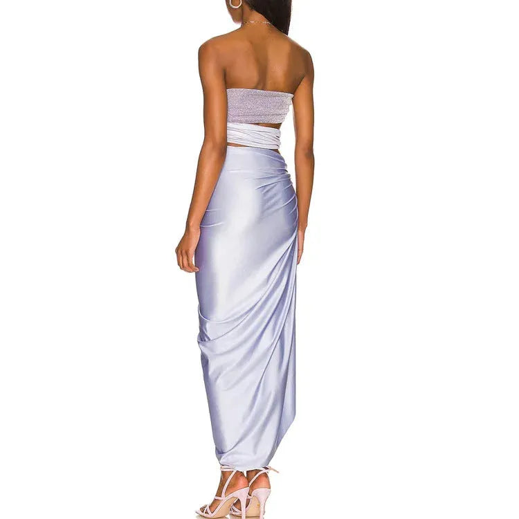 Purple one-piece swimsuit with a matching wrap skirt on a mannequin.