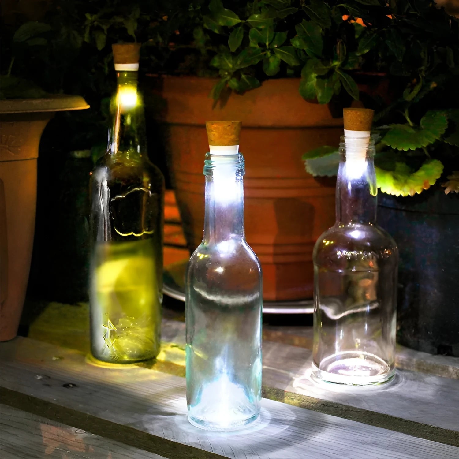 White plastic LED bottle cap light with 15 LEDs, shown on a glass bottle neck.
