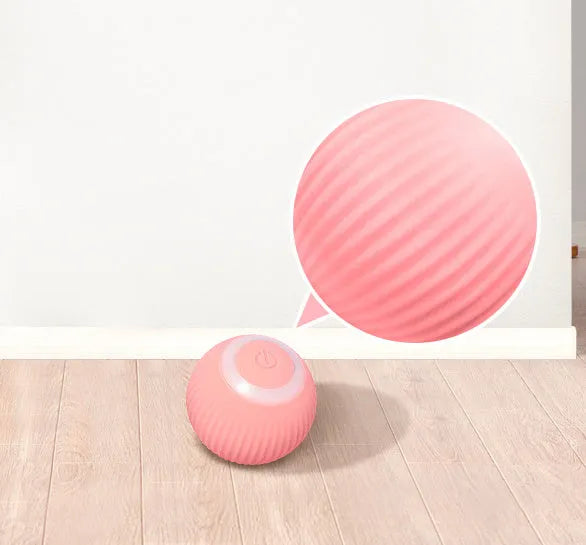 Cat Gravity Intelligent Rolling Ball 43mm plastic toy with black and white cat watching it move on a hard floor
