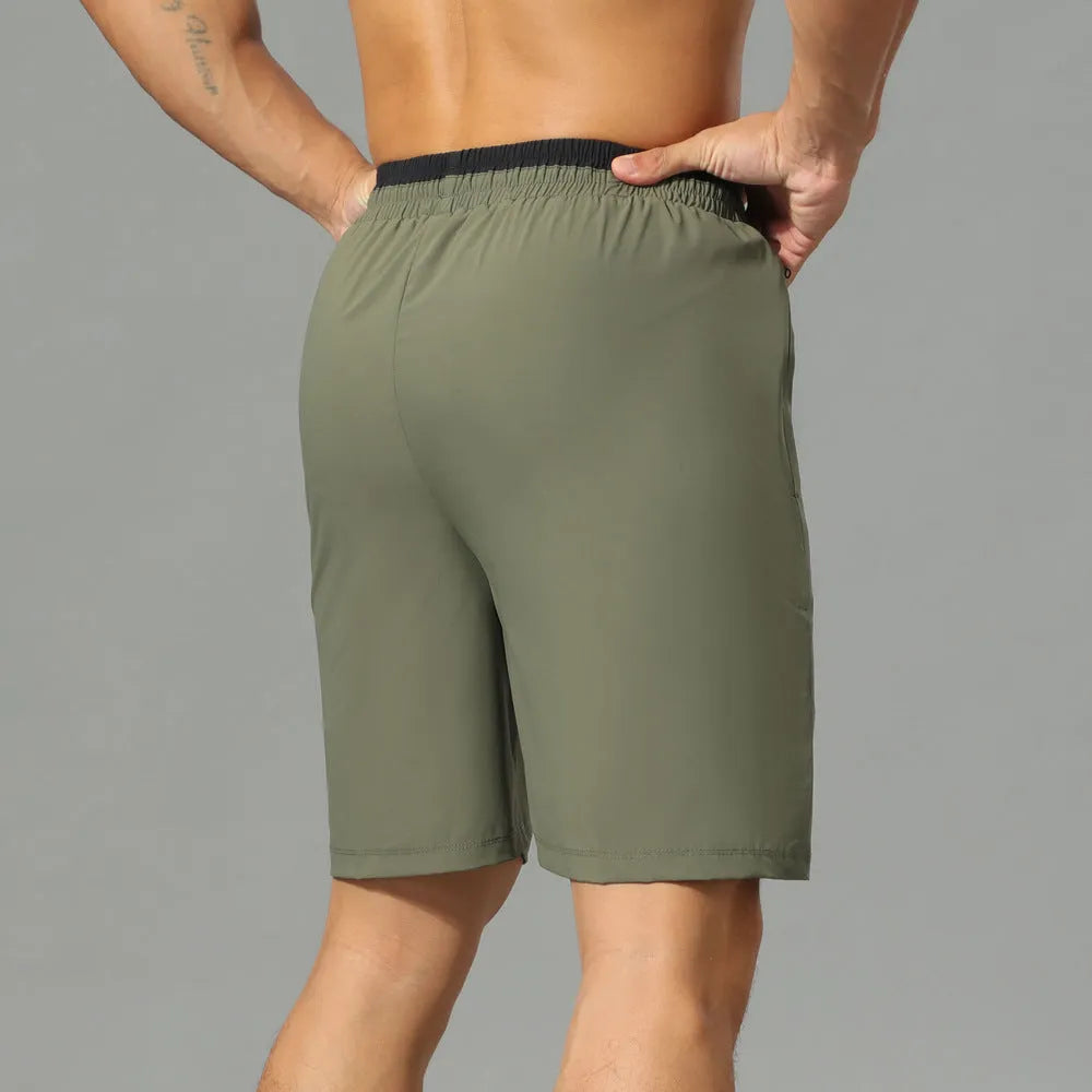 Men's loose grey ice silk quick-dry cropped running shorts on a white background.