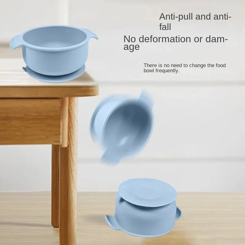 Blue silicone pet bowl with a suction cup base on a smooth floor