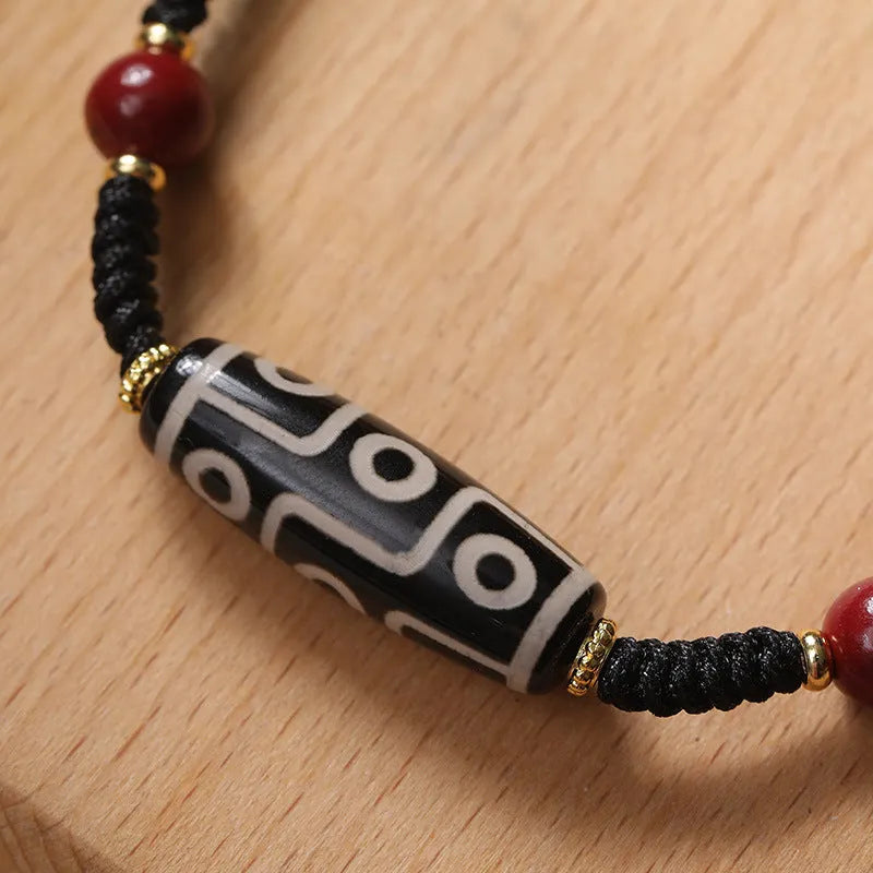Men's shrinkable agate bracelet with Tibetan Dzi bead patterns on a wrist