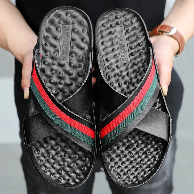 Men's white cowhide flip-flop sandals with a non-slip PU sole on a wooden deck.