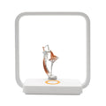 Blue wireless charging table lamp with integrated phone charger and decorative night light
