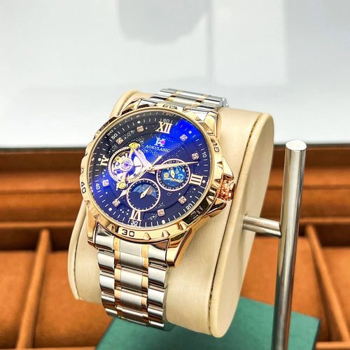 Automatic mechanical men's watch with rose gold case and black dial on wrist.