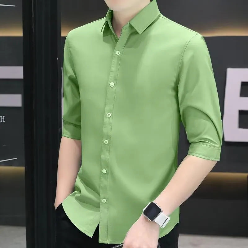 Men's slim-fit half-sleeve shirt in linen and silk blend, shown in grass green colour with non-ironing finish.