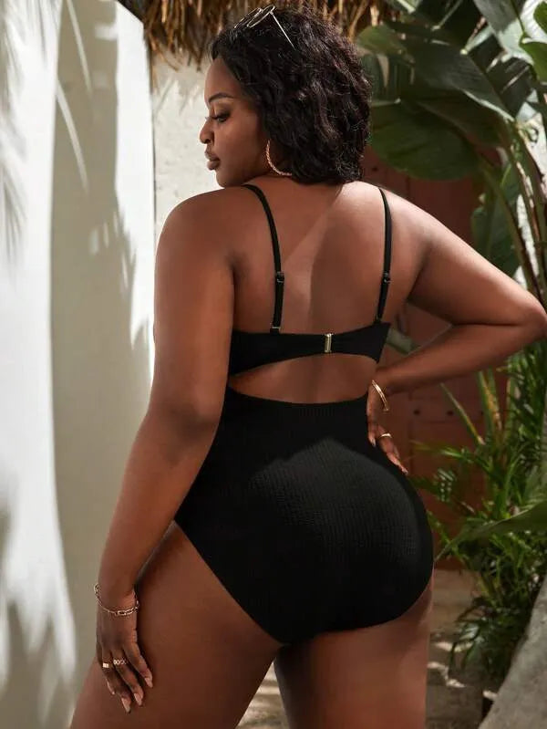 Plus size women's black slimming one-piece swimsuit with triangle sling and sleeveless design, sizes S-5XL