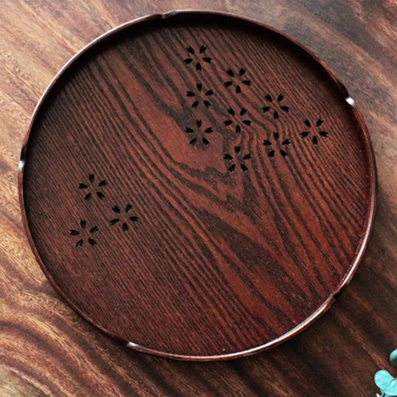 Wooden shallow plate with hollow cherry blossom decoration, 30 cm diameter.