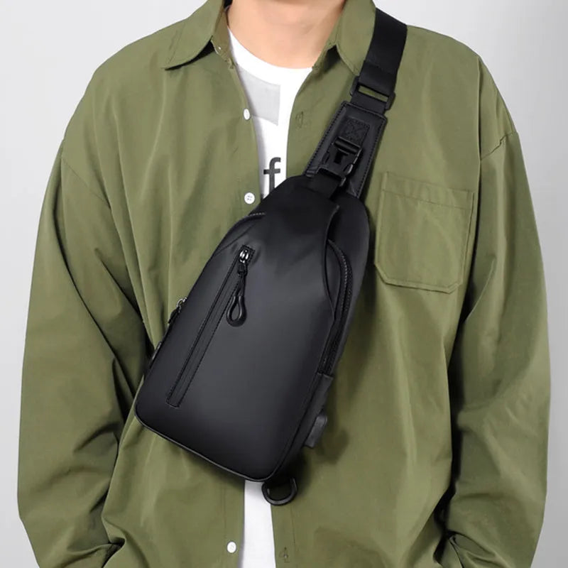 Black sling crossbody backpack for men with zip closure and soft handle, solid colour