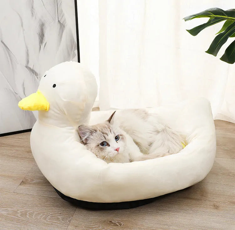 Blue duck-shaped fluffy pet bed for small dogs and cats on floor