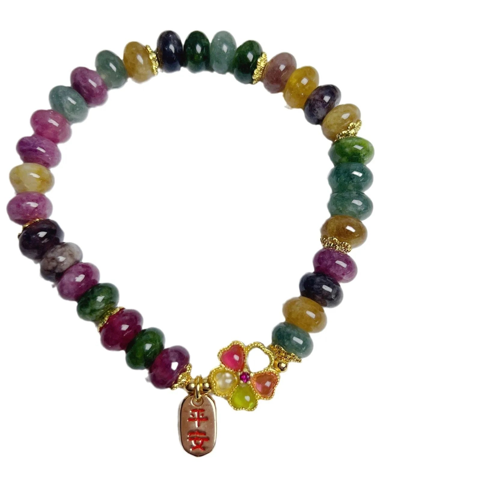 Women's bracelet with colourful tourmaline abacus beads and artificial crystal on wrist.