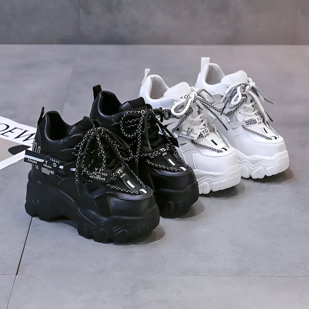 Women's white mesh platform sports shoes with cross strap and round toe on a rubber sole.