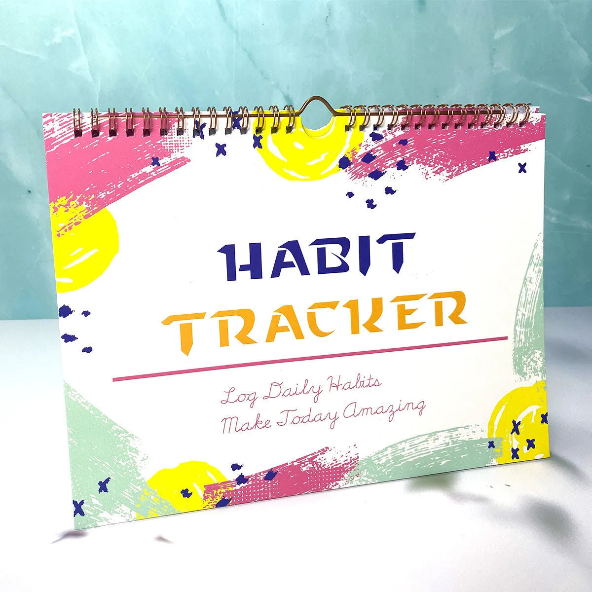 English habit tracking notebook with 12 pages in four colour options