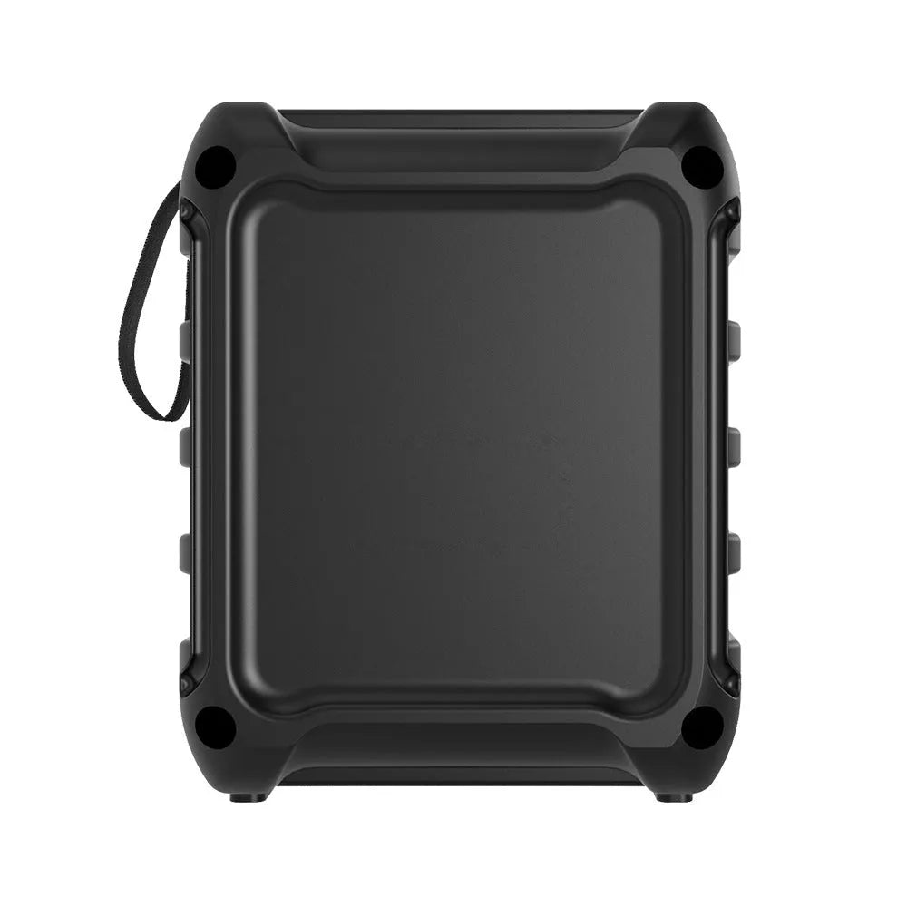 Compact portable Bluetooth speaker with USB charging cable on a table.