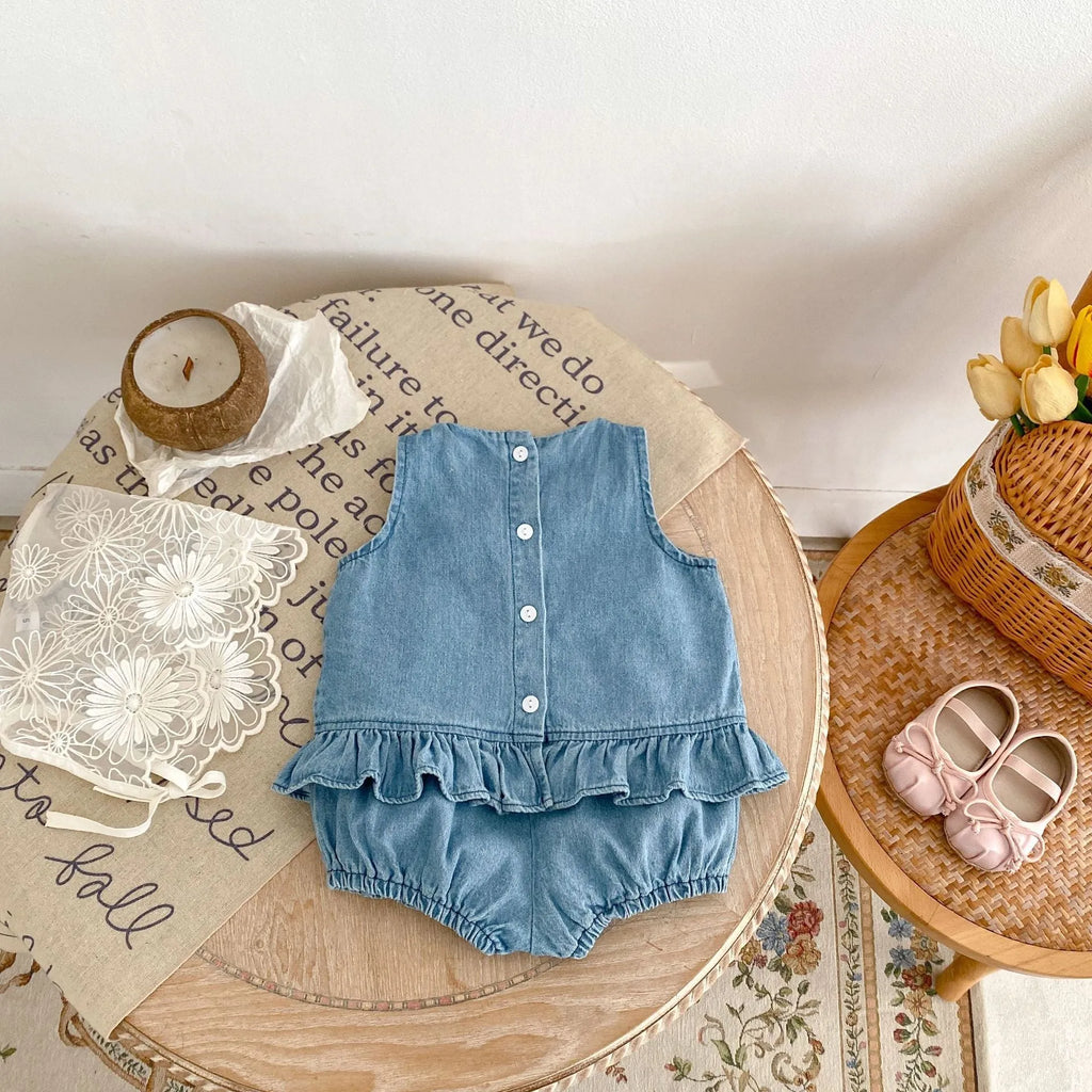 Baby girl denim cotton sleeveless two-piece suit with shorts on a white background