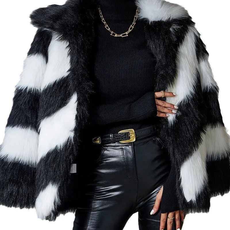 Minimalist faux fur coat with a contrasting colour lapel and a fur collar.