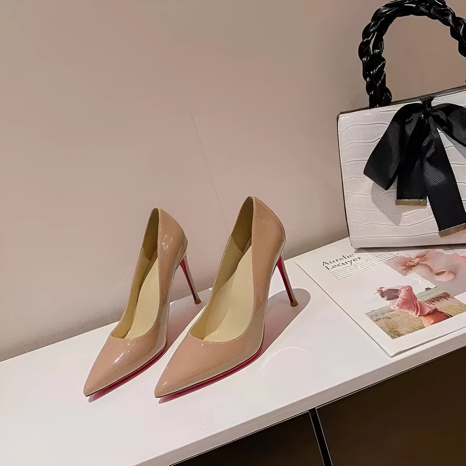 Women's pointed low-cut patent leather stiletto heels in black solid colour with stiletto heel and pointed toe