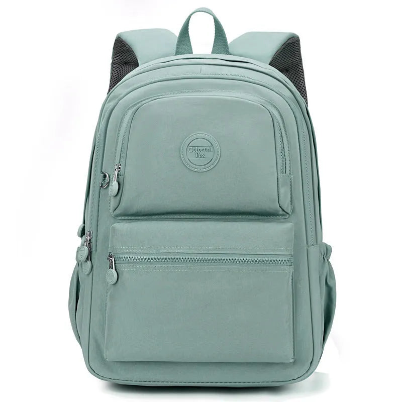Women's waterproof nylon travel backpack with multi-compartments in rose red colour showing organisational features