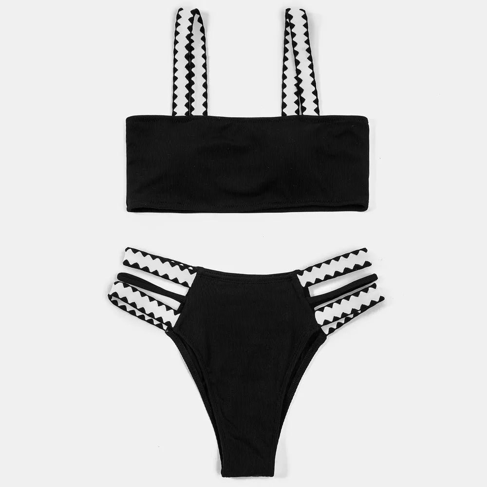 Black women's one-piece swimsuit with hollowed-out split design and briefs cut.