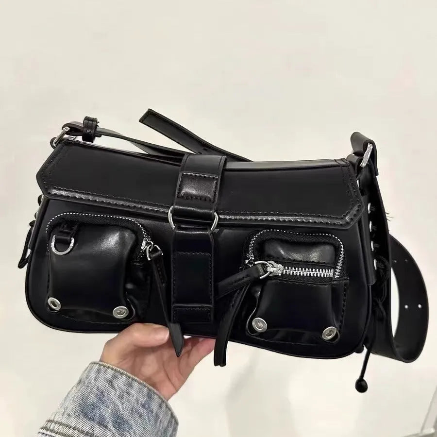 Black medium-hard PU women's baguette messenger bag with adjustable strap and zippered internal change compartment.