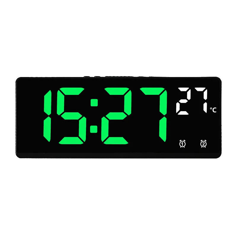 Electronic alarm clock with large LED screen showing time and temperature on desktop
