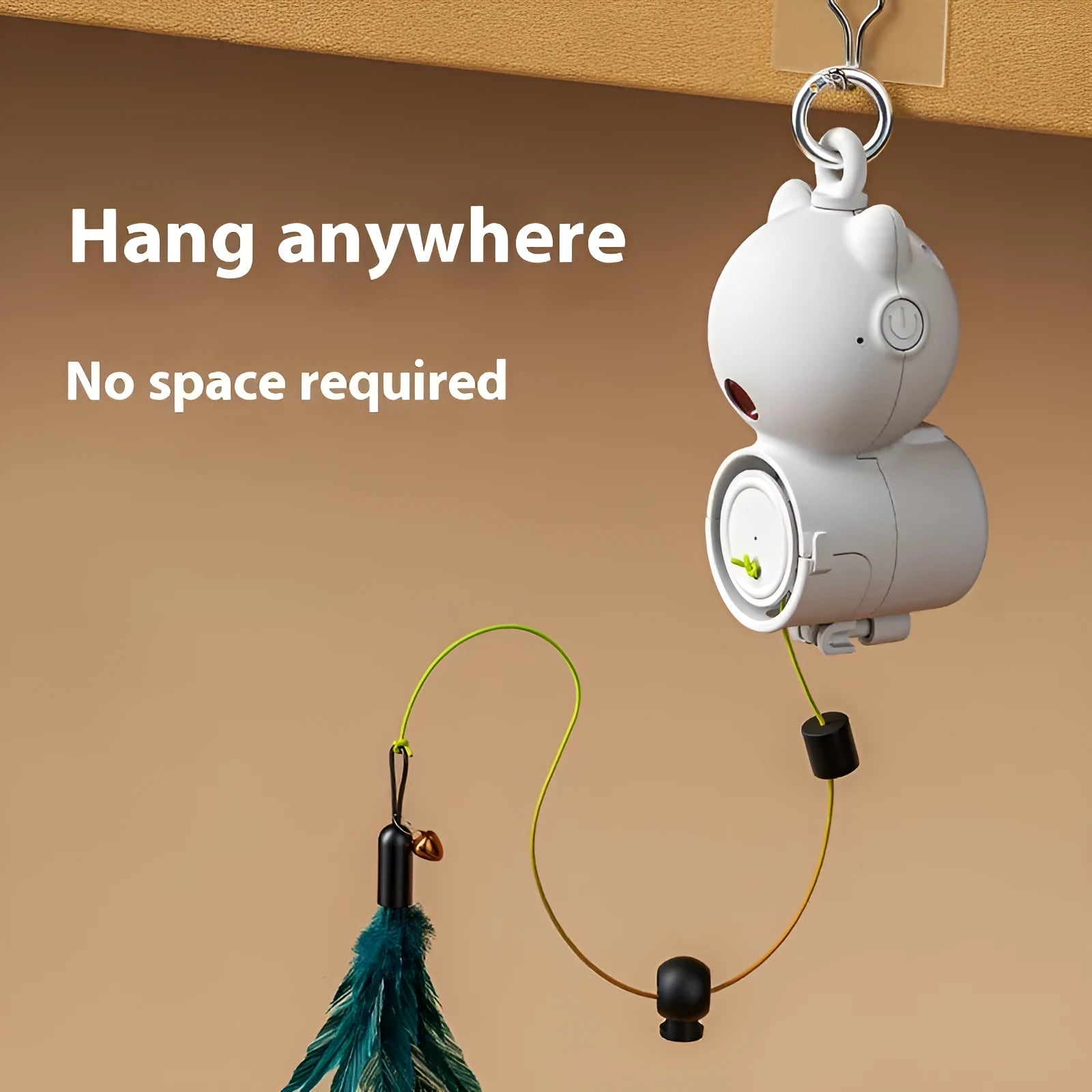 White plastic hanging retractable cat toy with feather lure and USB cable on hook