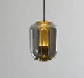 Minimalist Nordic pendant light with a spherical glass globe shade in smoky grey colour.