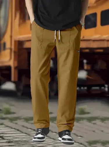 Men's straight-leg polyester trousers in light grey on a hanger