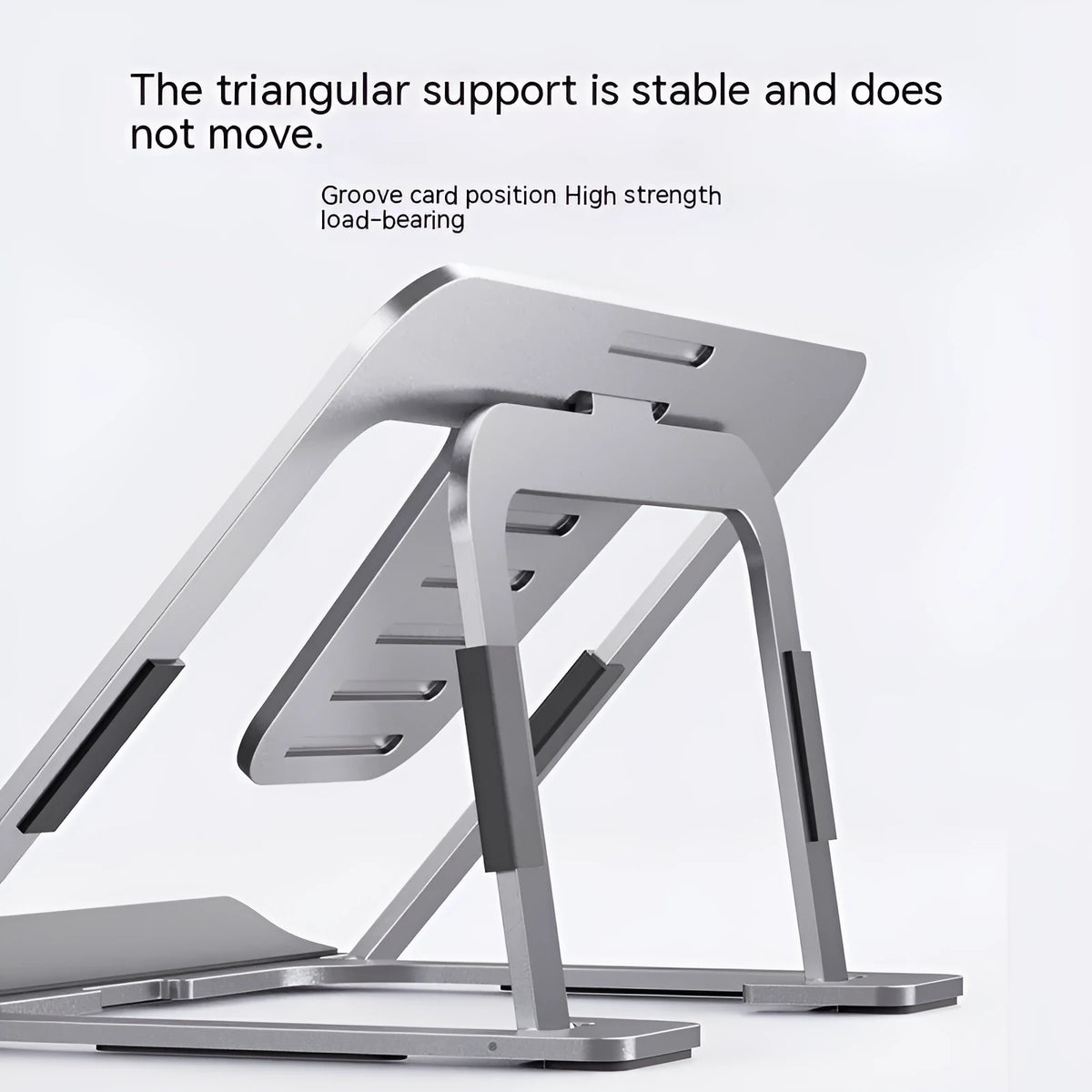 Foldable aluminium alloy tablet and phone holder in dark gray on a desk