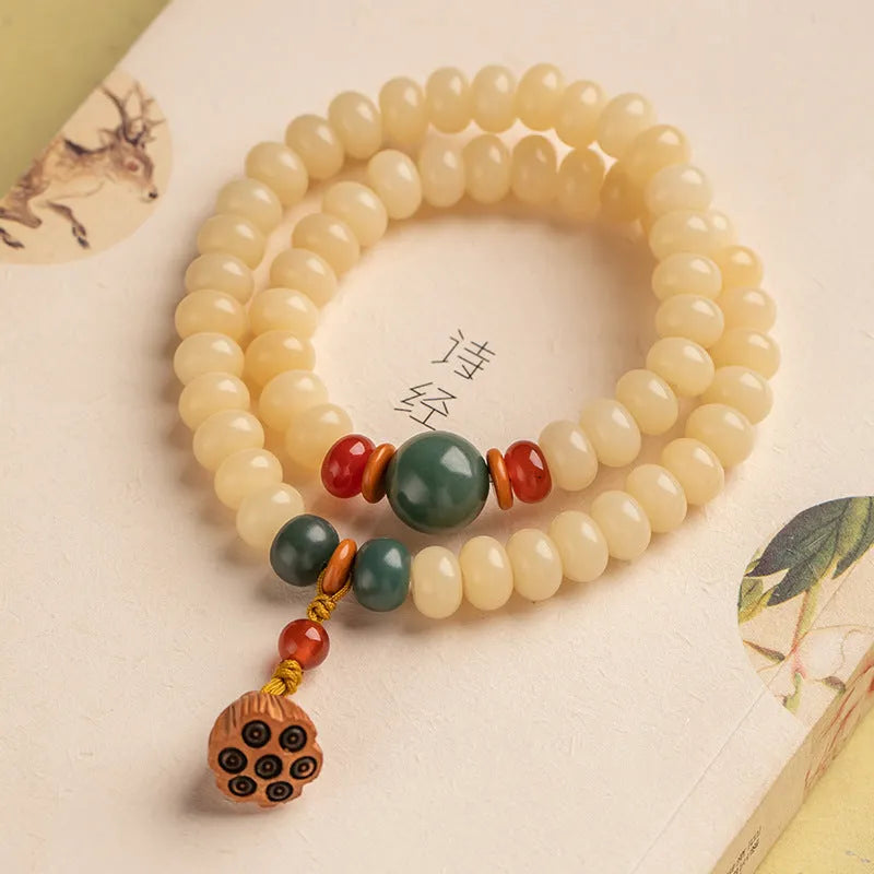 Women's wooden Bodhi root bracelet with 6x9mm flat round beads in cream colour