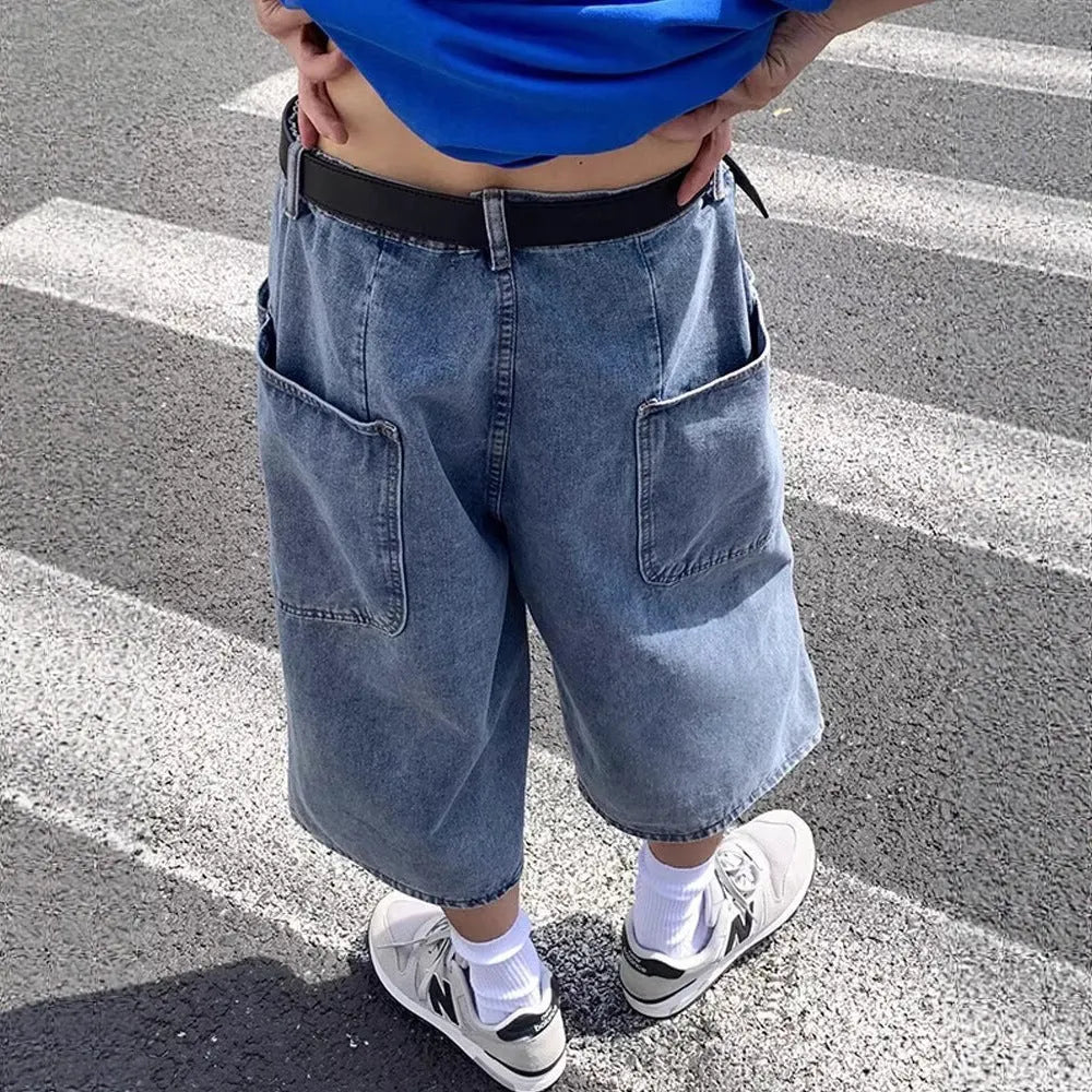 Men's blue washed denim pirate shorts with a cropped length, high waist, and straight leg.