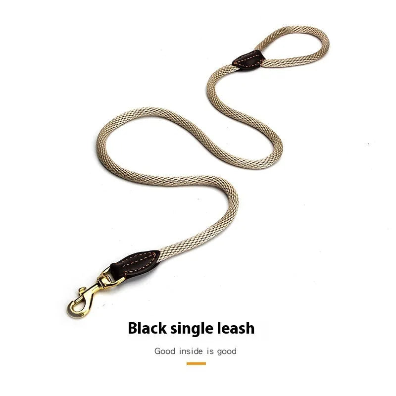 Black nylon dog hand holding rope leash shown with clip and integrated hand loop, size options available.