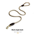 Black nylon dog hand holding rope leash shown with clip and integrated hand loop, size options available.