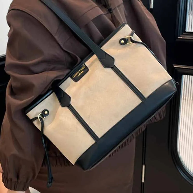 PU leather shoulder bag in black, horizontal square shape with double shoulder straps and sewing line detailing
