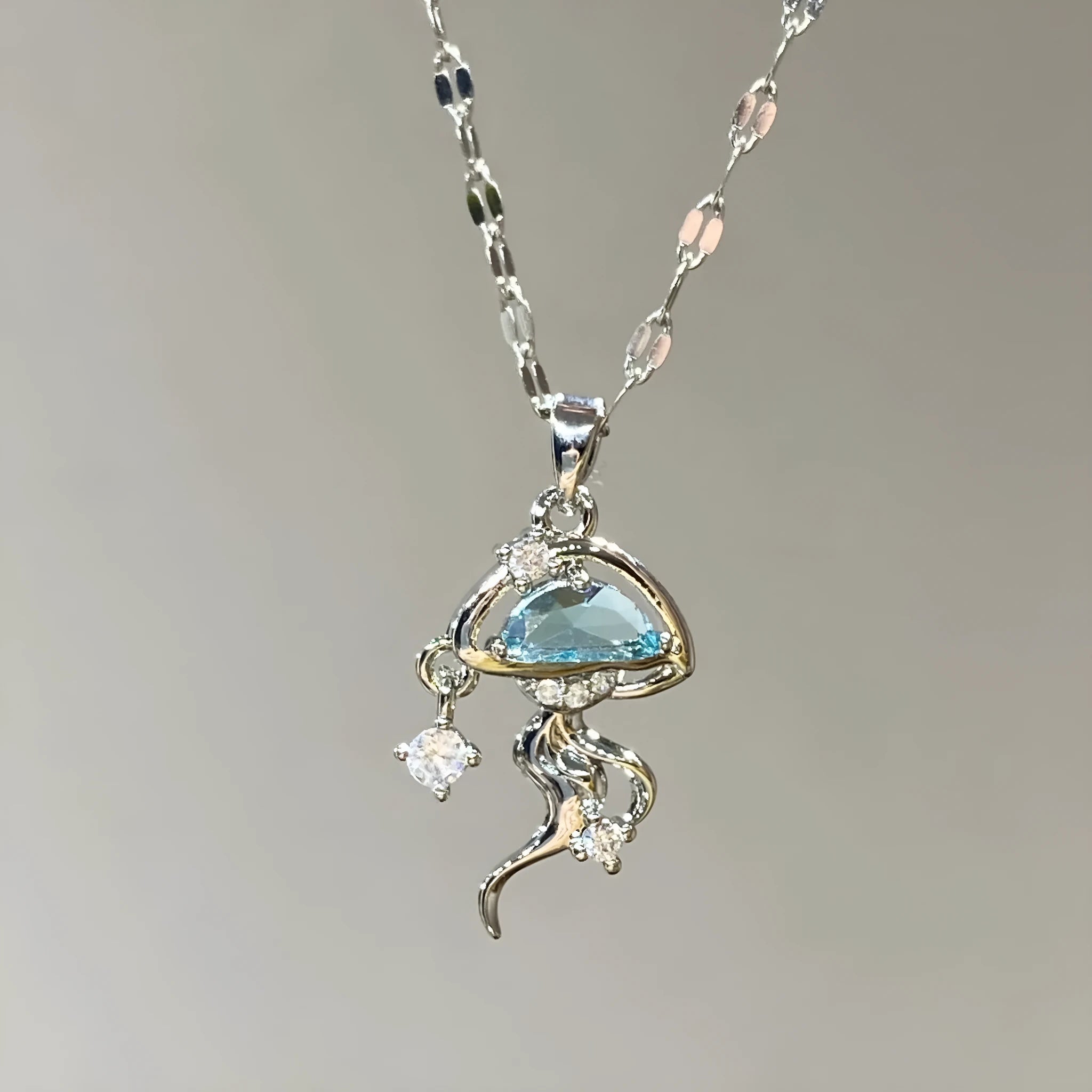 S925 sterling silver blue jellyfish necklace with adjustable chain on white background