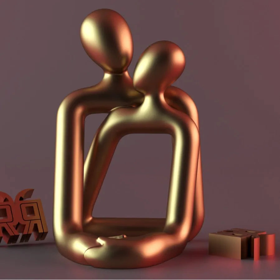 Modern minimalist loving couple resin statue in milky white or gold finish on wooden surface