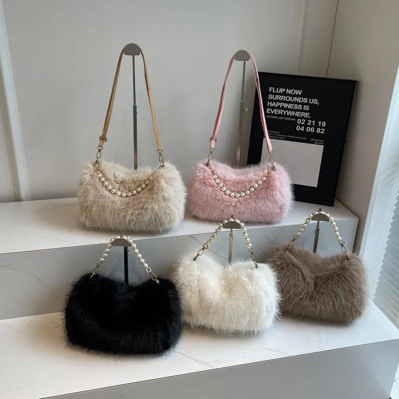 Plush shoulder bag with pearl chain, 27cm wide, shown in black for autumn winter commuting