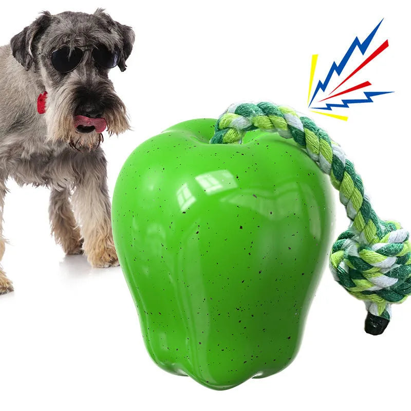 Green plastic apple-shaped dog toy with a molar design and a food dropping ball function.