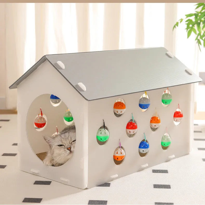 Grey integrated cat furniture with sisal scratching panel, plush-lined round nest, and tunnel with dangling bell ball toy.