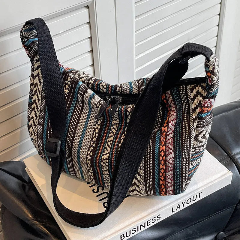 Women's ethnic style canvas dumpling crossbody bag showing sewing thread details and large capacity design
