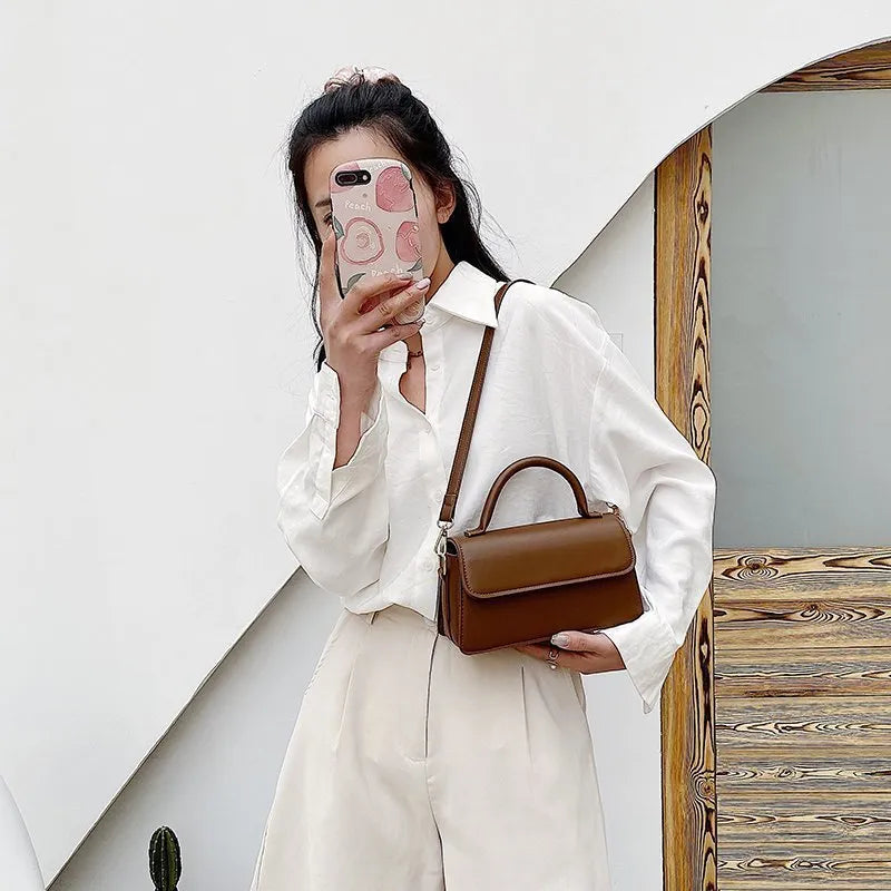 Retro textured solid colour PU shoulder bag in horizontal square shape with sewing thread detail