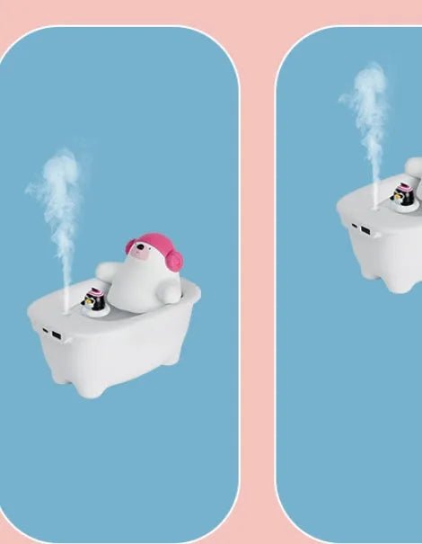 White USB-powered air humidifier and aromatherapy diffuser unit on a desk.