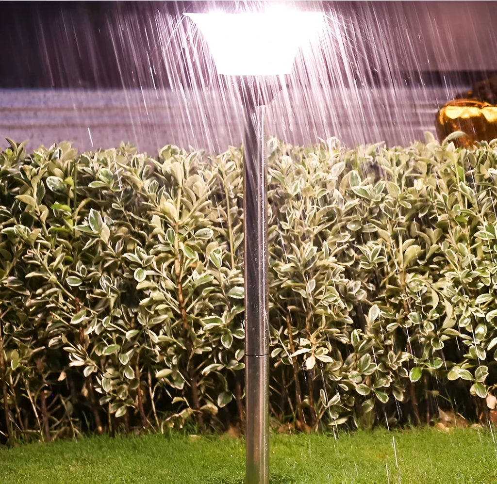 Solar-powered outdoor street light with solar panel and LED illumination in stainless steel and ABS construction